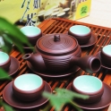 Bộ ấm chén tử sa vuốt tay quai ngang chỉ đỏ